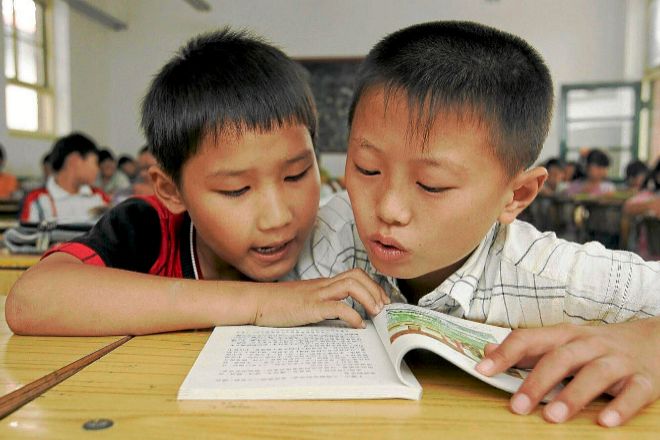 Estudiantes de 11 años en un aula la Escuela Haidian Xingzhi de Pekín en una imagen de archivo previa al estallido de la pandemia de Covid.