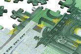 Montaje de un puzzle con un billete de euro
