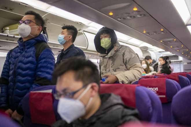 February 2, 2020 - Shanghai, lt;HIT gt;China lt;/HIT gt;: Travelers wearing protective masks prepare to disembark from a Juneyao Airlines flight from Nanning Wuxu International Airport. The Australian Government announced that travellers from or who have passed through Mainland lt;HIT gt;China lt;/HIT gt; will be denied entry to Australia for the next two weeks. There are fears that the coronavirus may spread through out lt;HIT gt;China lt;/HIT gt; and beyond during the Chinese Lunar New Year holidays - the world's largest annual migration. Chinese citizens were expected to make around 3 billion trips over the 40 day holiday period. (Dave Tacon/Contacto) 02/02/2020 ONLY FOR USE IN SPAIN