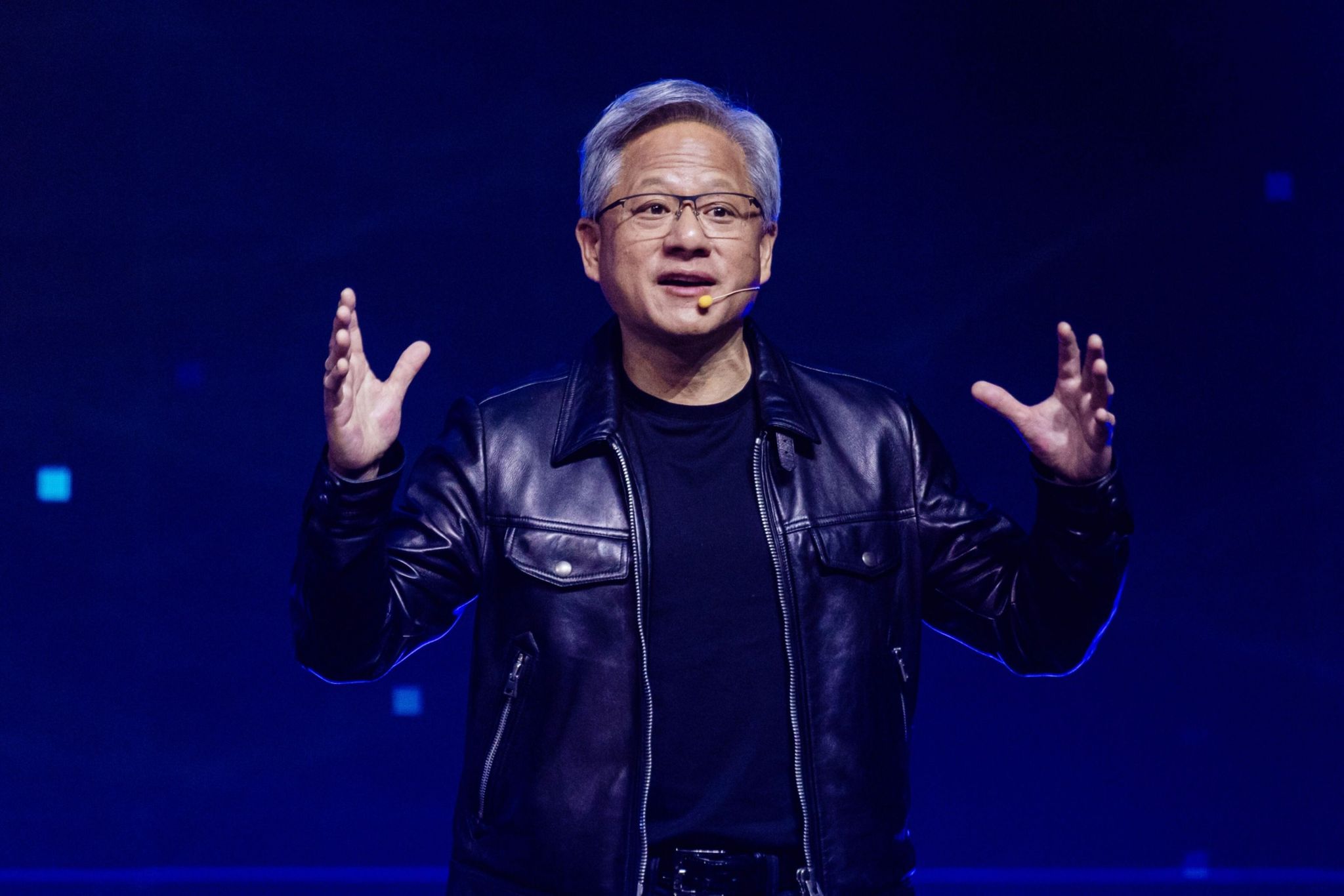 Jensen Huang, co-founder and chief executive officer of  lt;HIT gt;Nvidia lt;/HIT gt; Corp., speaks during a Hon Hai Precision Industry Co. event in Taipei, Taiwan, on Wednesday, Oct. 18, 2023. Hon Hai, best known as the maker of Apple Inc.'s iPhone, is expanding its push into electric vehicles by integrating artificial intelligence, attempting to bolster its strategy for one of the hottest segments of the automotive industry. Photographer: Annabelle Chih/Bloomberg